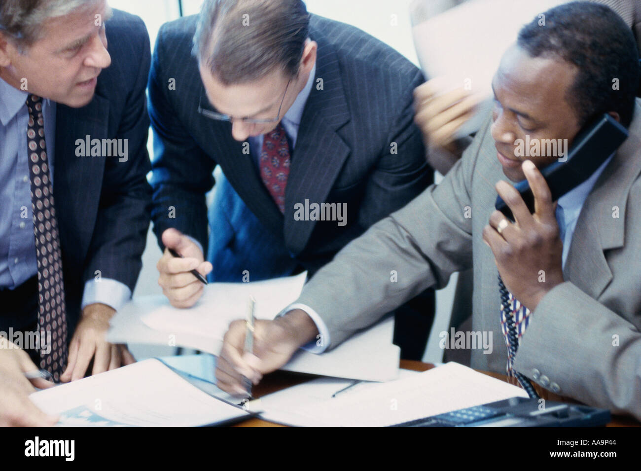Three businessmen in a meeting Stock Photo - Alamy