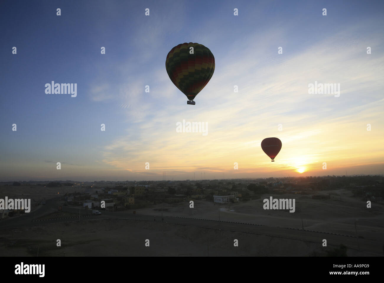 Hot Air Ballooning over fields, villages and ancient monuments in Egypt Stock Photo