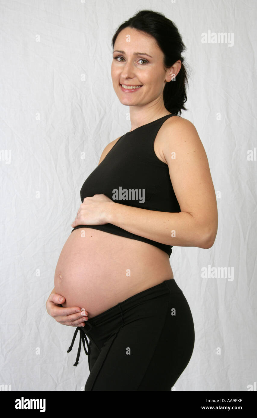 Pregnant Woman Wearing a Black Top and Trousers Stock Photo
