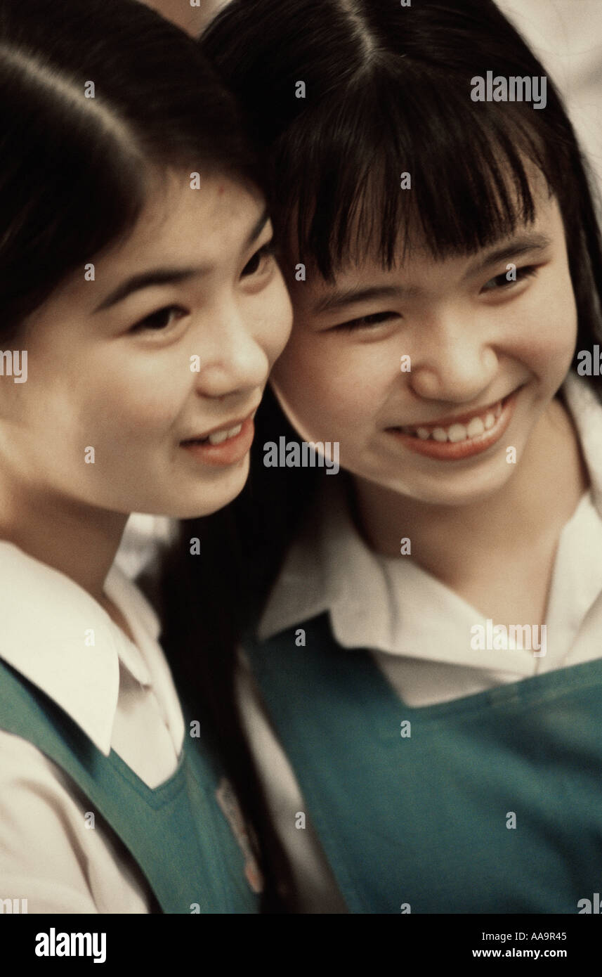 Two teenage girls smiling Stock Photo - Alamy