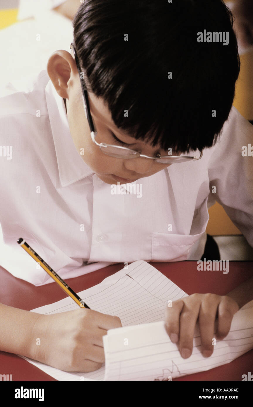 Boy Using Paper Boy holding exam paper hi-res stock photography and images - Alamy