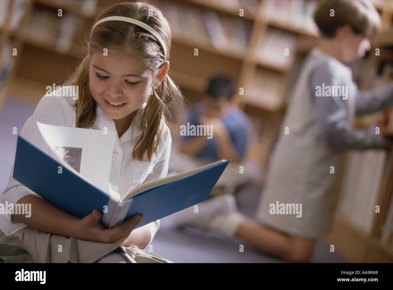 Girl student in library uniform hi-res stock photography and images - Alamy