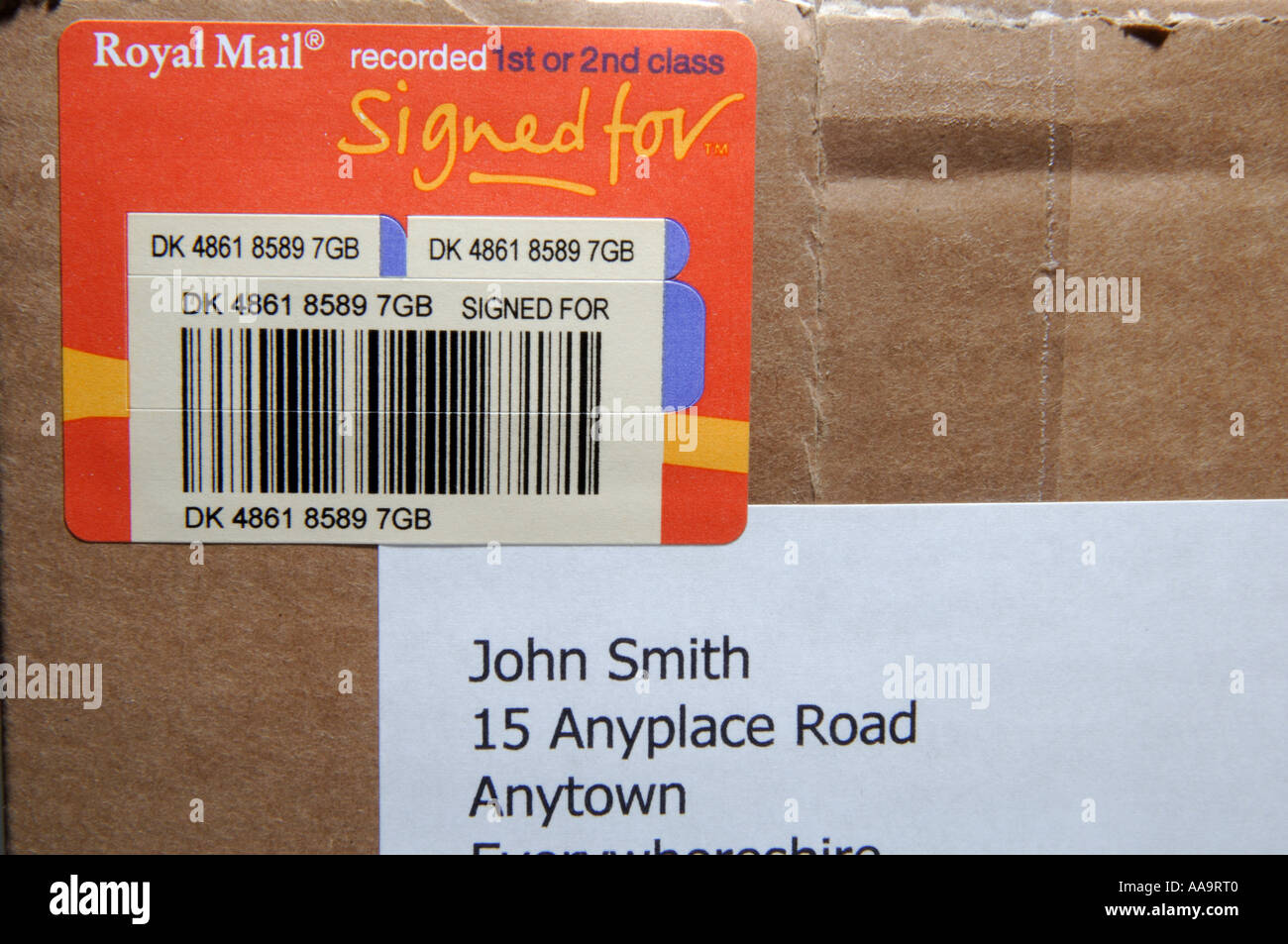 Close up of a Royal Mail recorded delivery label on a parcel showing  recording barcode and part of the address label Stock Photo - Alamy