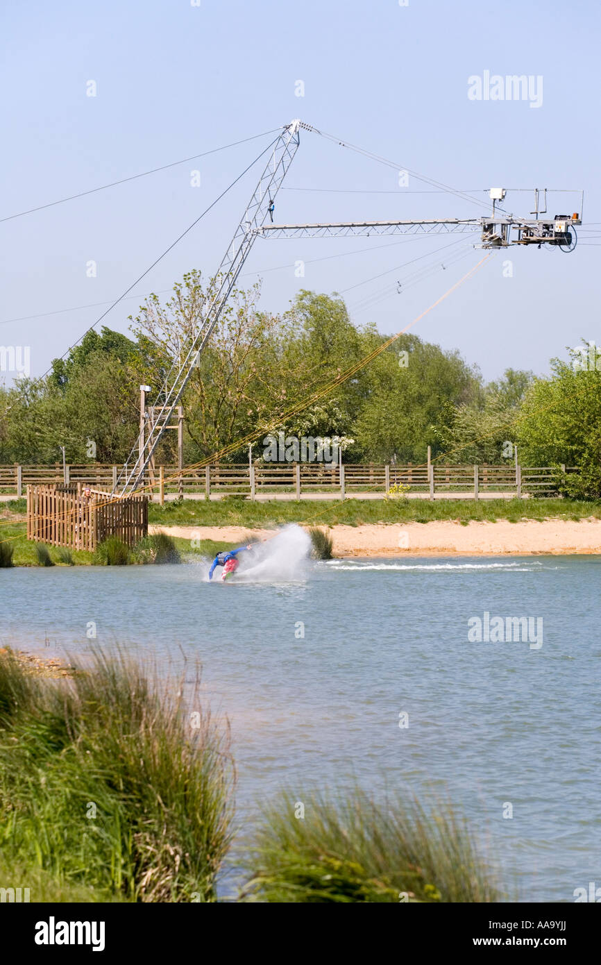 Wake boarding with a cable tow at Watermark Ski, Cotswold Water Park, South Cerney, Gloucestershire Stock Photo
