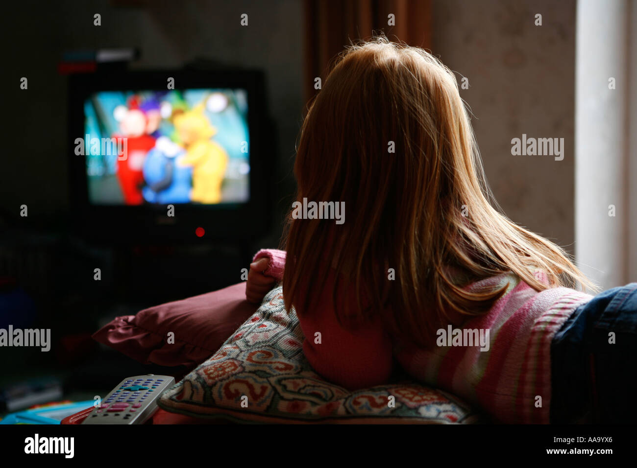 Young girl watching the Teletubbies Stock Photo