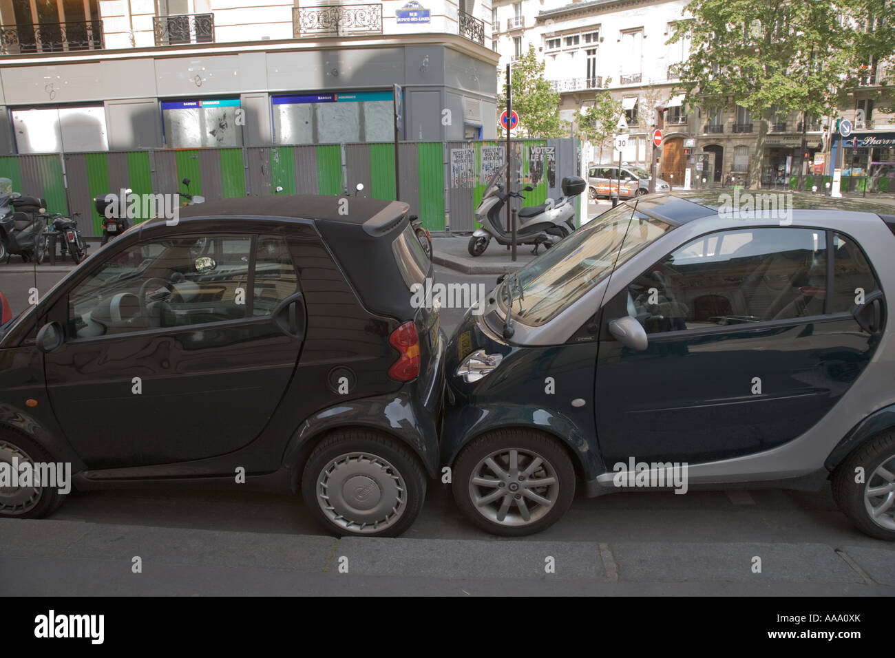 Smart cars parked touching bumper to bumper in Paris Stock Photo Alamy