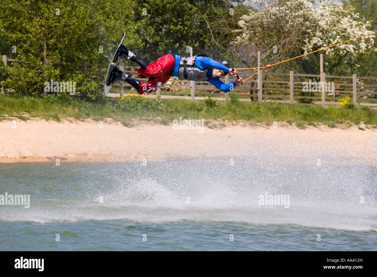 Wake boarding with a cable tow at Watermark Ski, Cotswold Water Park, South Cerney, Gloucestershire Stock Photo