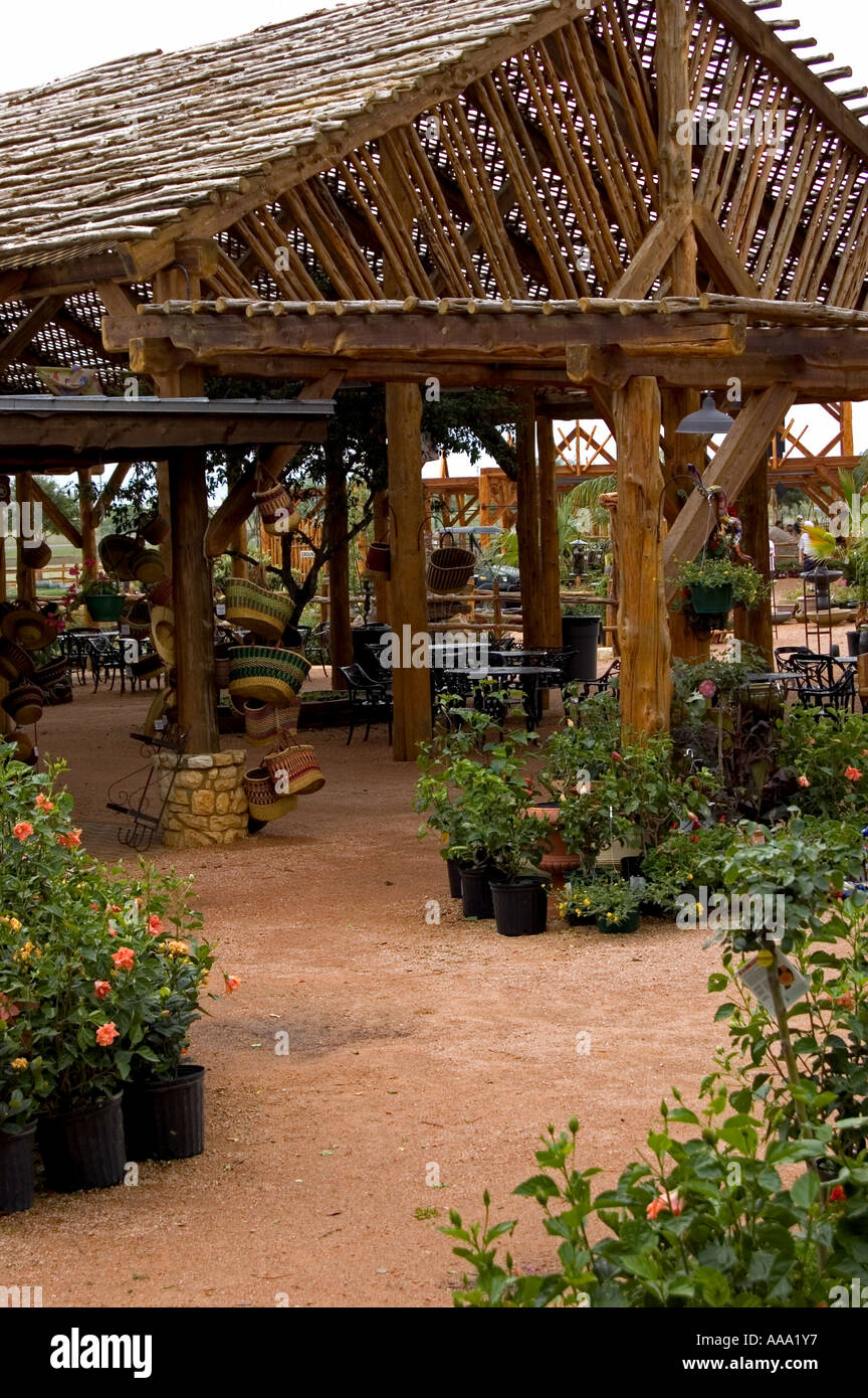 Patio roof structure with outdoor tables and chairs below Stock Photo