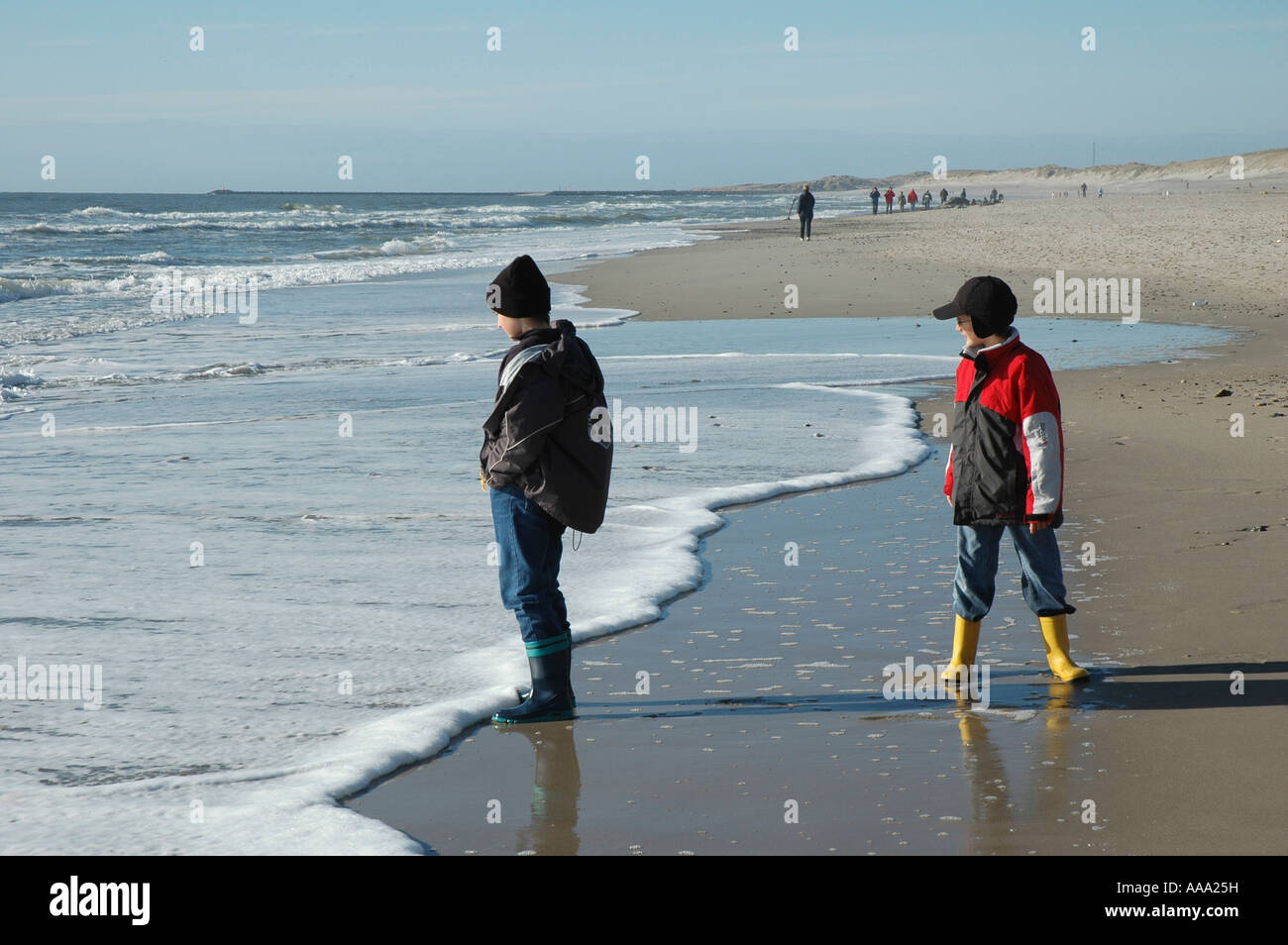 Boys playing at the seaside Stock Photo - Alamy