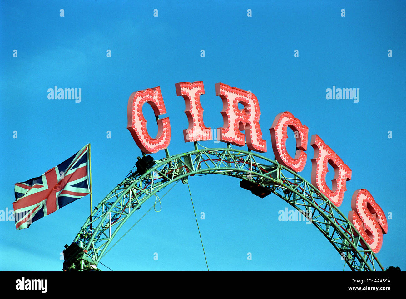 A circus sign and British Flag with blue sky Stock Photo