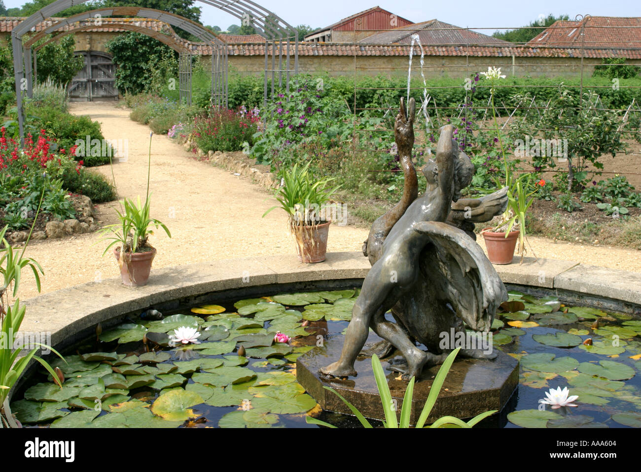 Statue in victorian walled garden Stock Photo Alamy