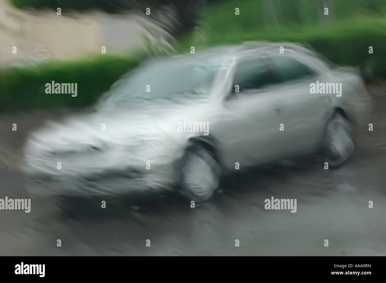 Car behind a wet blurry glass Stock Photo Alamy