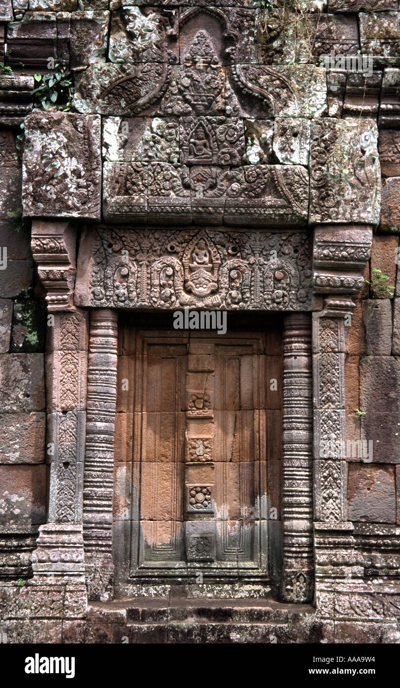 Carved stone door and elaborate lintel at Wat Phou in southern Laos Stock Photo