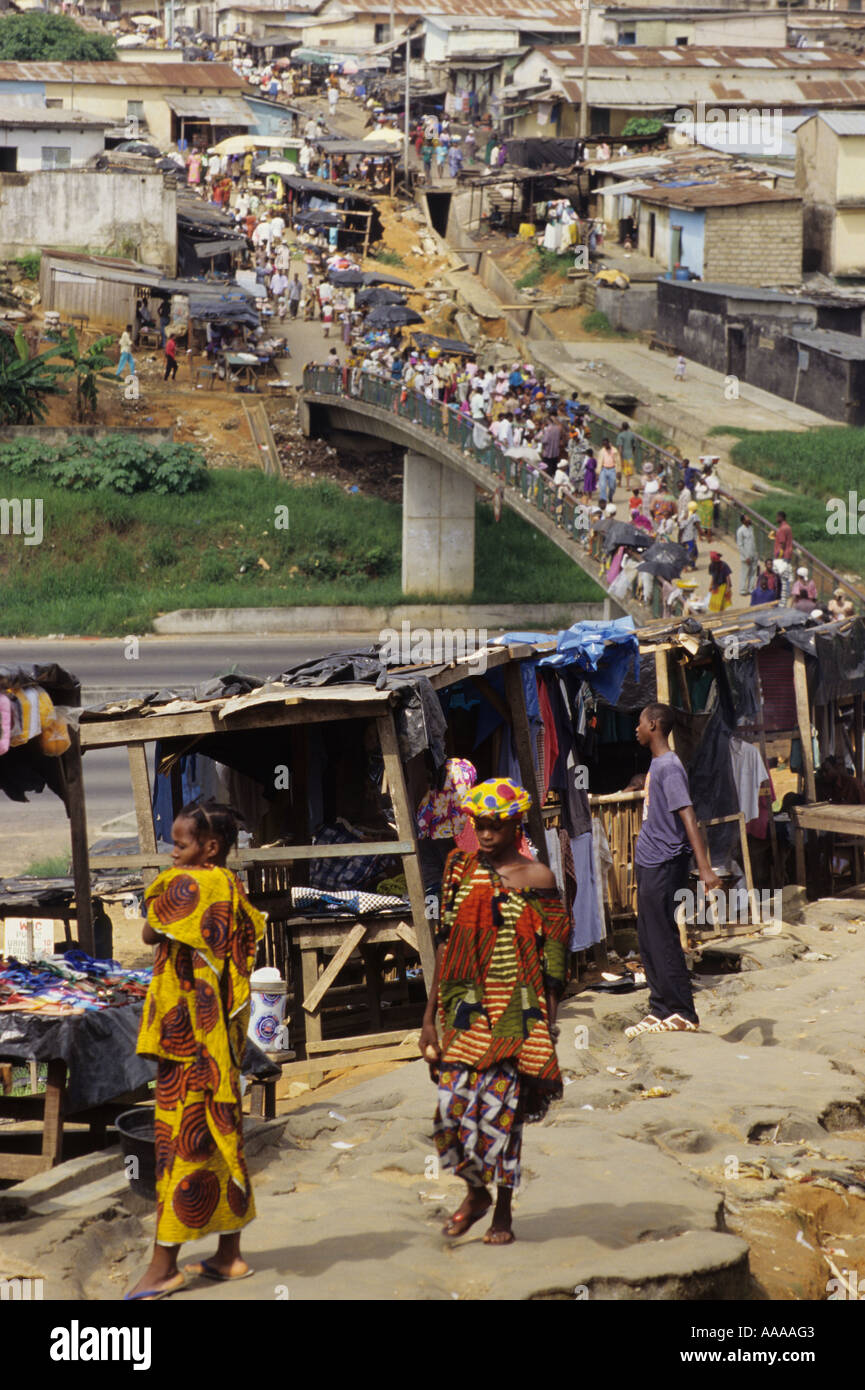 Abidjan, Ivory Coast, Cote d'Ivoire, West Africa. Pedestrian Bridge over Six Lane Highway. Ivorian Women Walking. Stock Photo