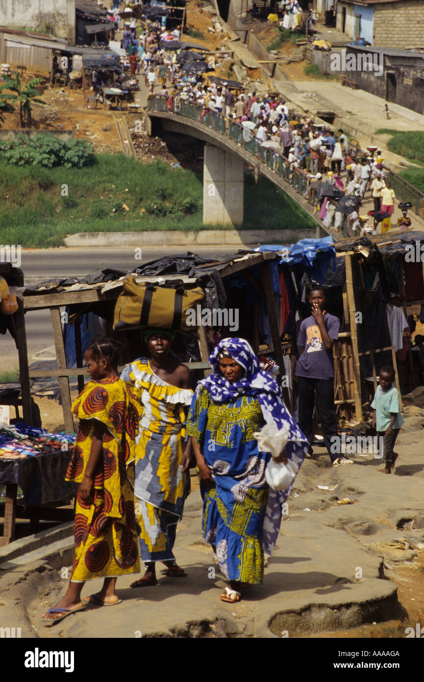 Abidjan, Ivory Coast, Cote d'Ivoire, West Africa. Pedestrian Bridge over Six Lane Highway. Ivorian Women Walking. Stock Photo