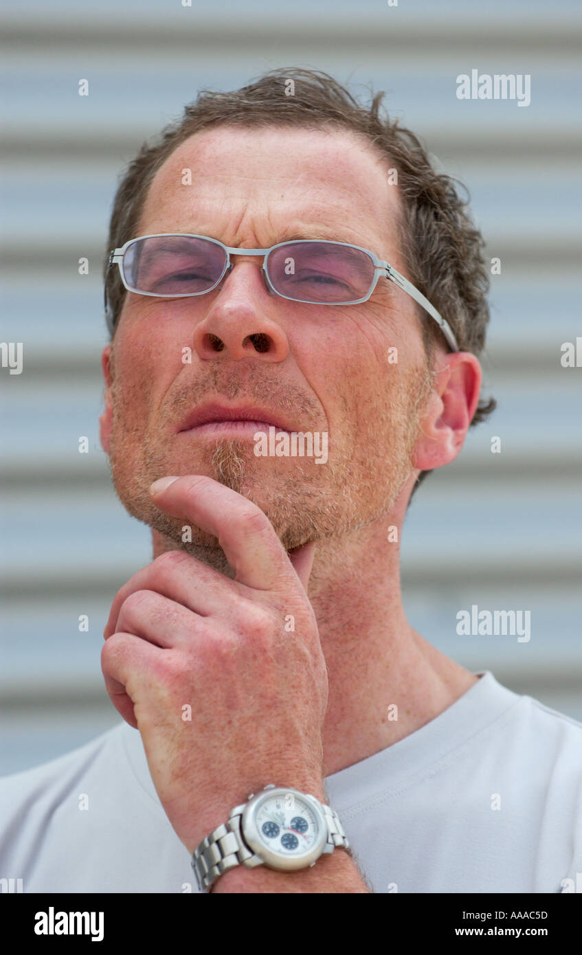 portrait of a fman in his 40s touching his chin thoughtfully Stock Photo