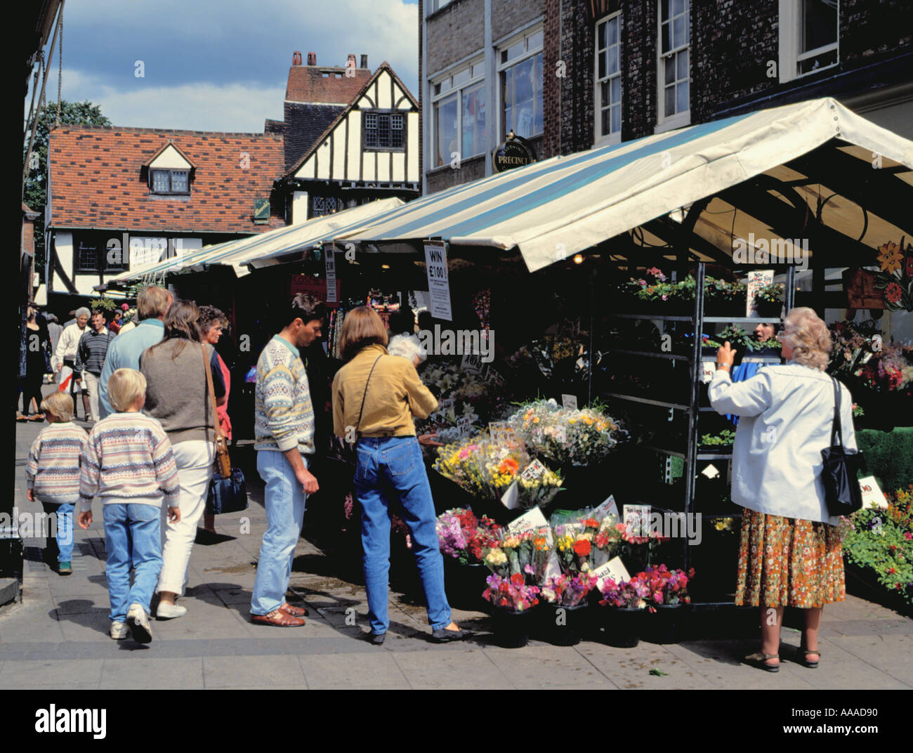 People at a flower stall at Newgate Market, City of York, North