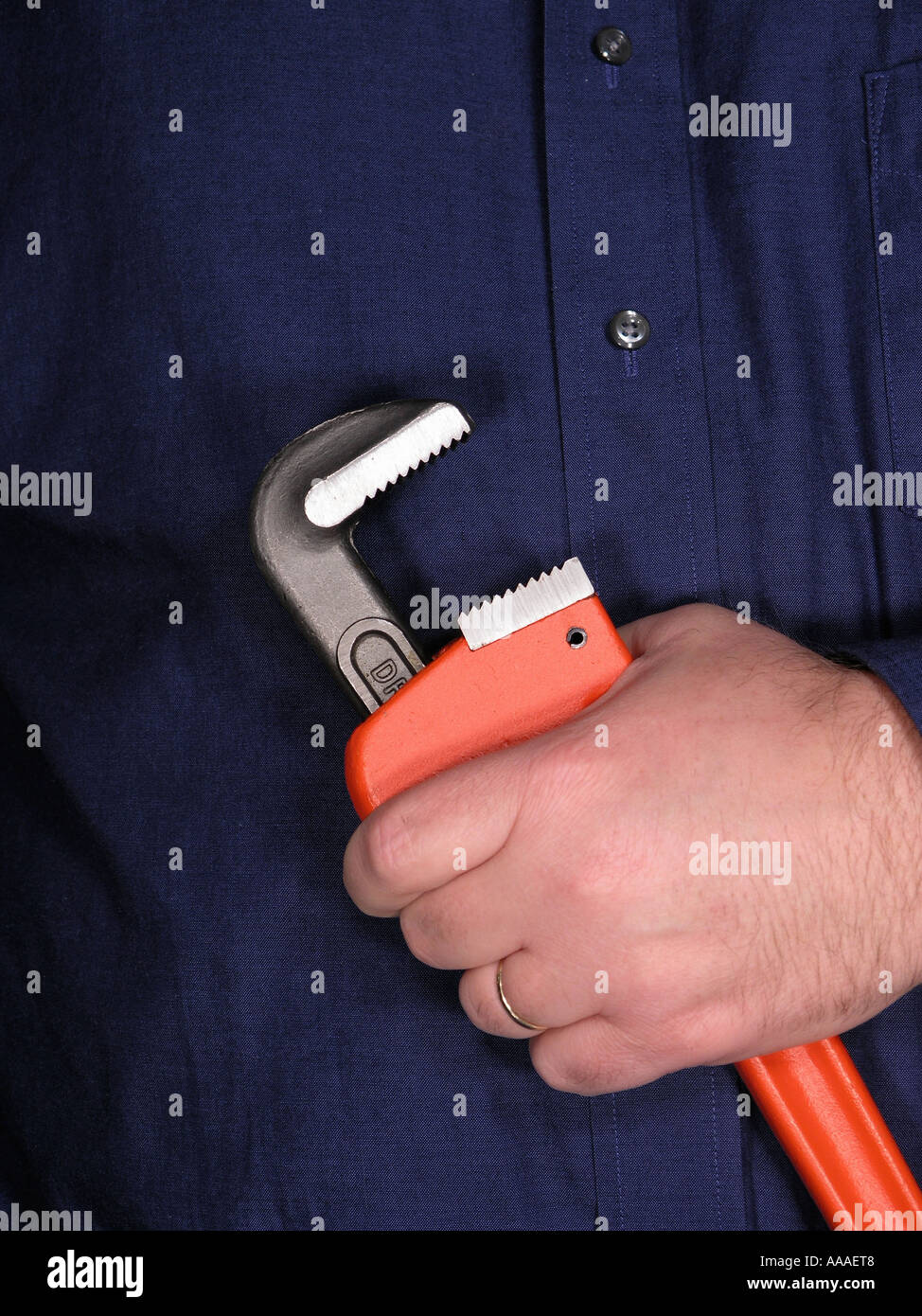 Workman holding tool Pipe Wrench Stock Photo Alamy