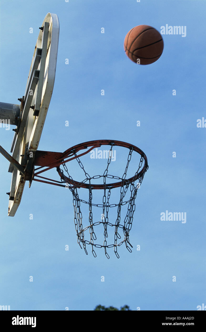 Low angle view of a basketball bouncing off the hoop Stock Photo Alamy