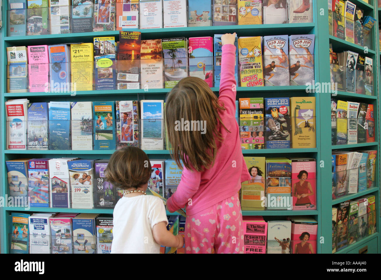 Florida St. Lucie County,Fort Pierce,Florida's Turnpike Rest Area,brochure rack,tourist attractions,girl girls,youngster youngsters youth youths femal Stock Photo