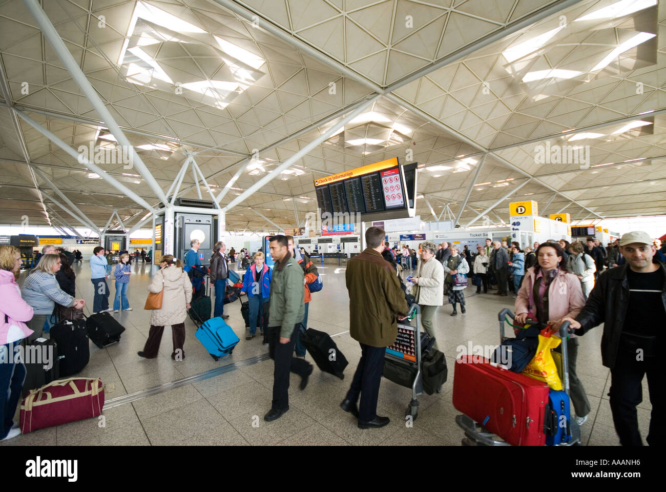 Passengers inside Stansted Airport England Britain Uk Stock Photo
