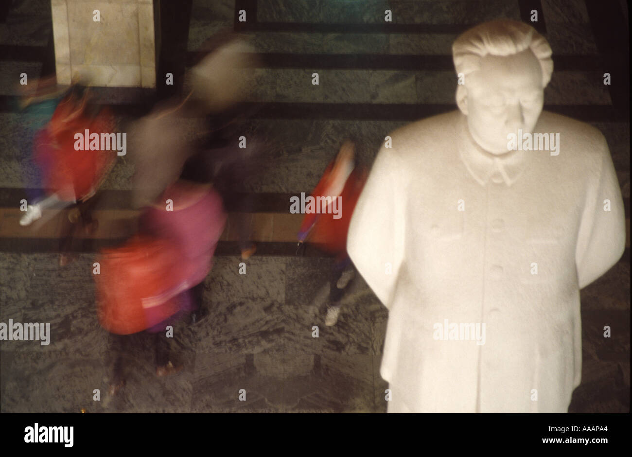 Tourist walking under the statue of Mao Zedong in the Military Museum