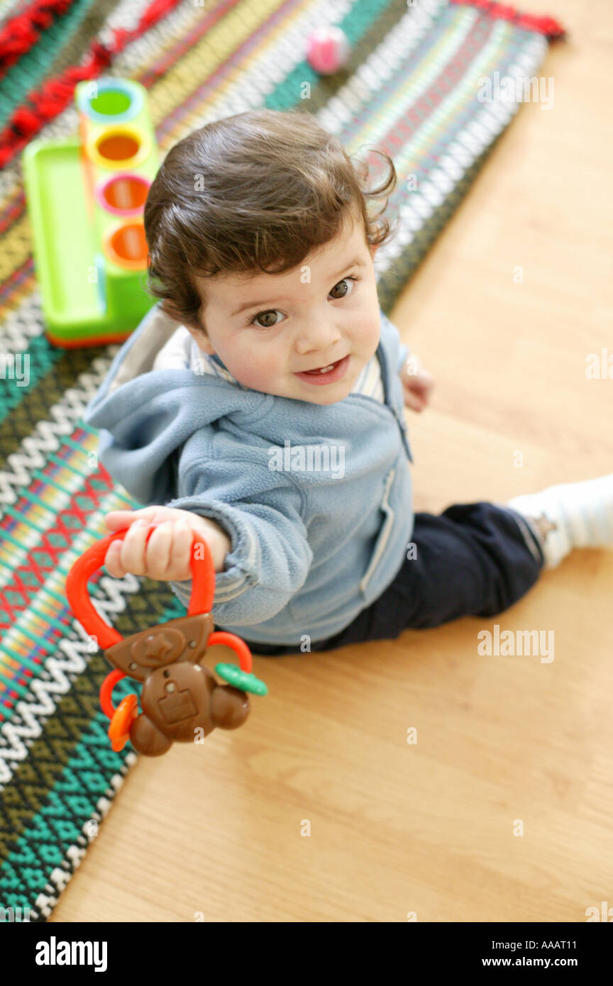 Baby boy smiling on floor hi-res stock photography and images - Alamy