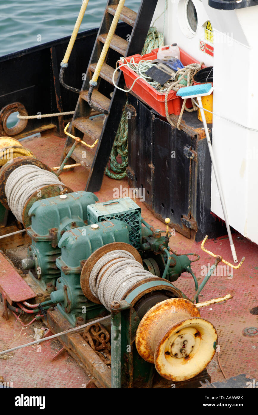 Close up fishing boat winch winching gear deck marine nautical uk hi