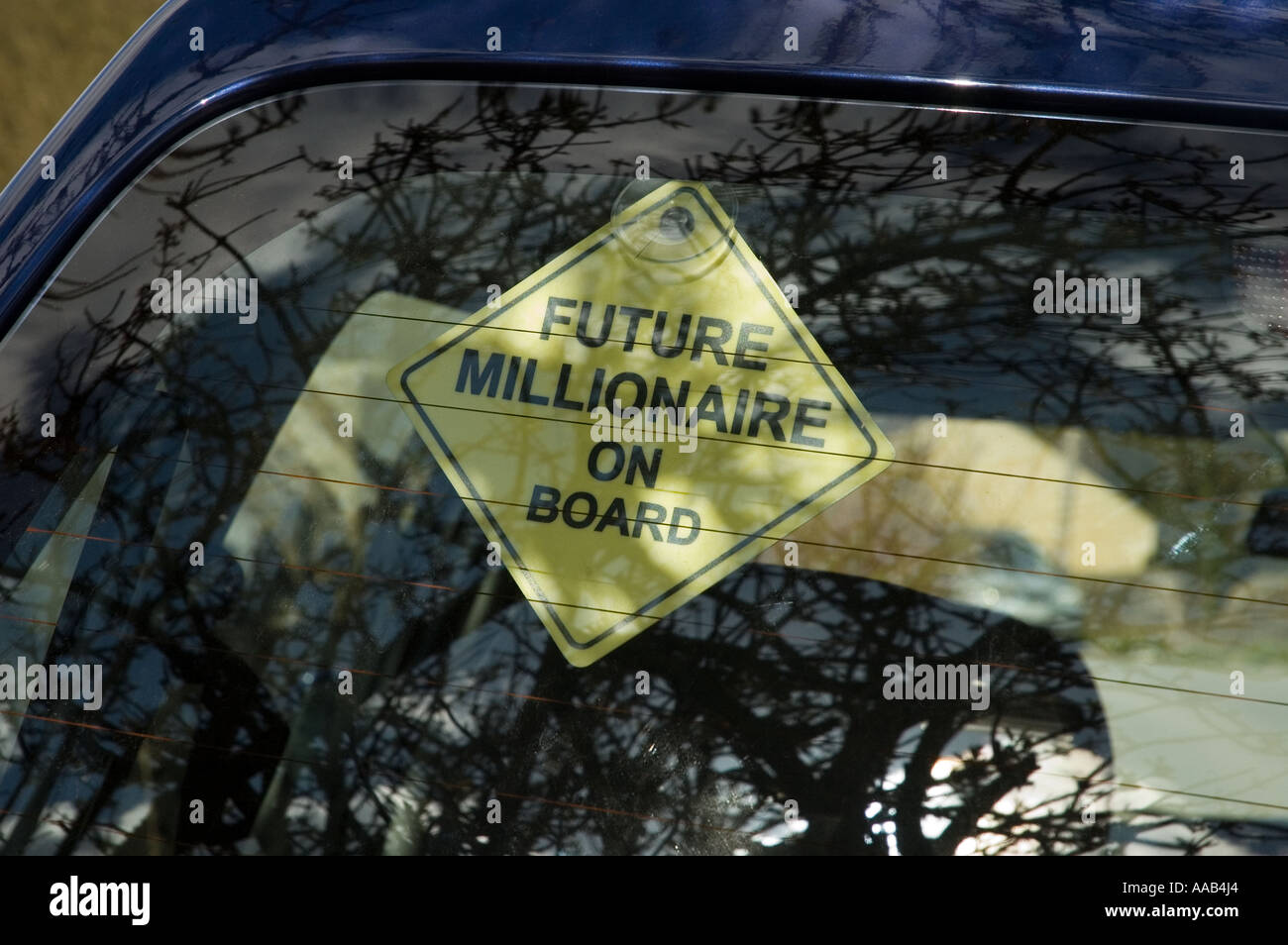 Future millionaire on board sticker in car window Stock Photo