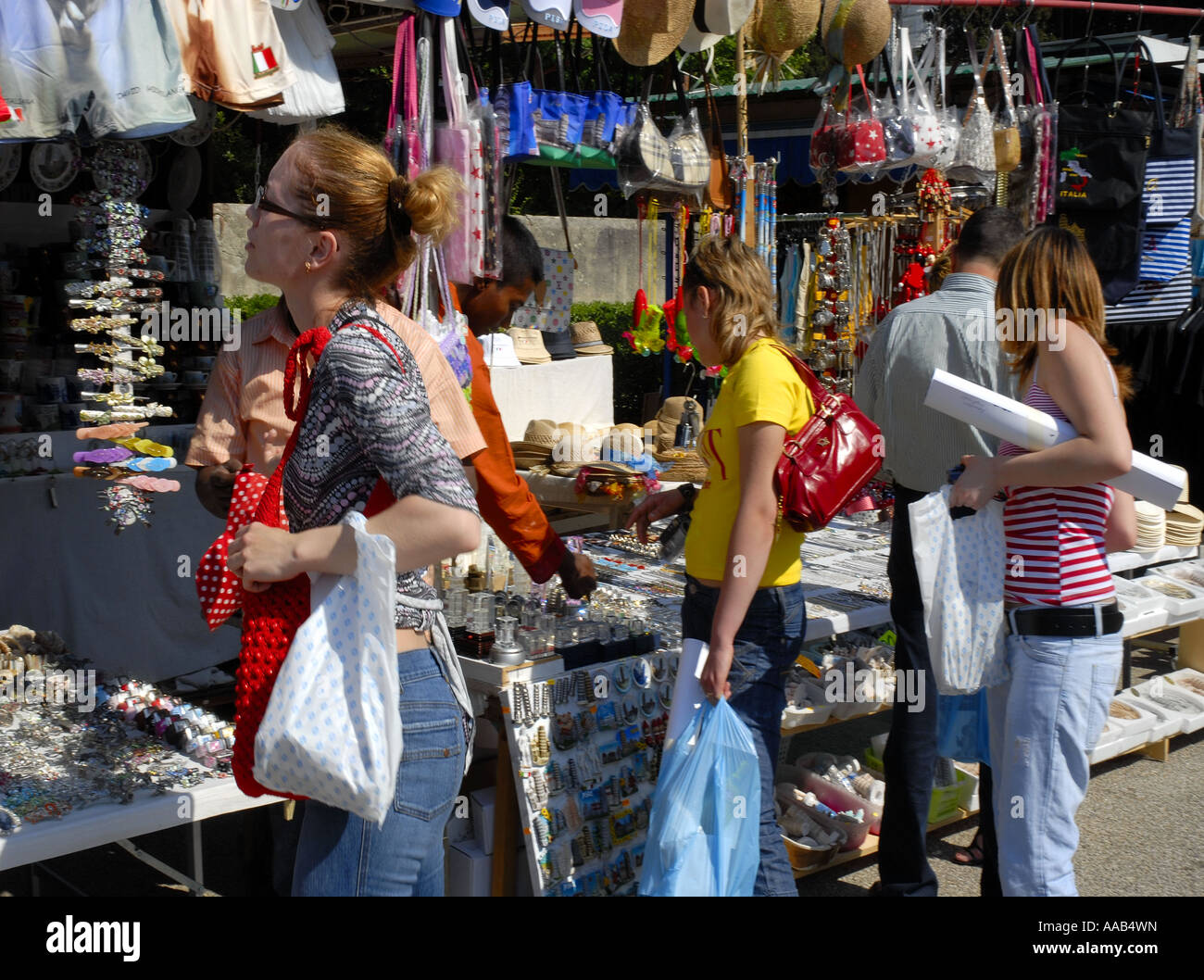 Tourists Looking at Handbag Stall, Pisa, Italy Stock Photo