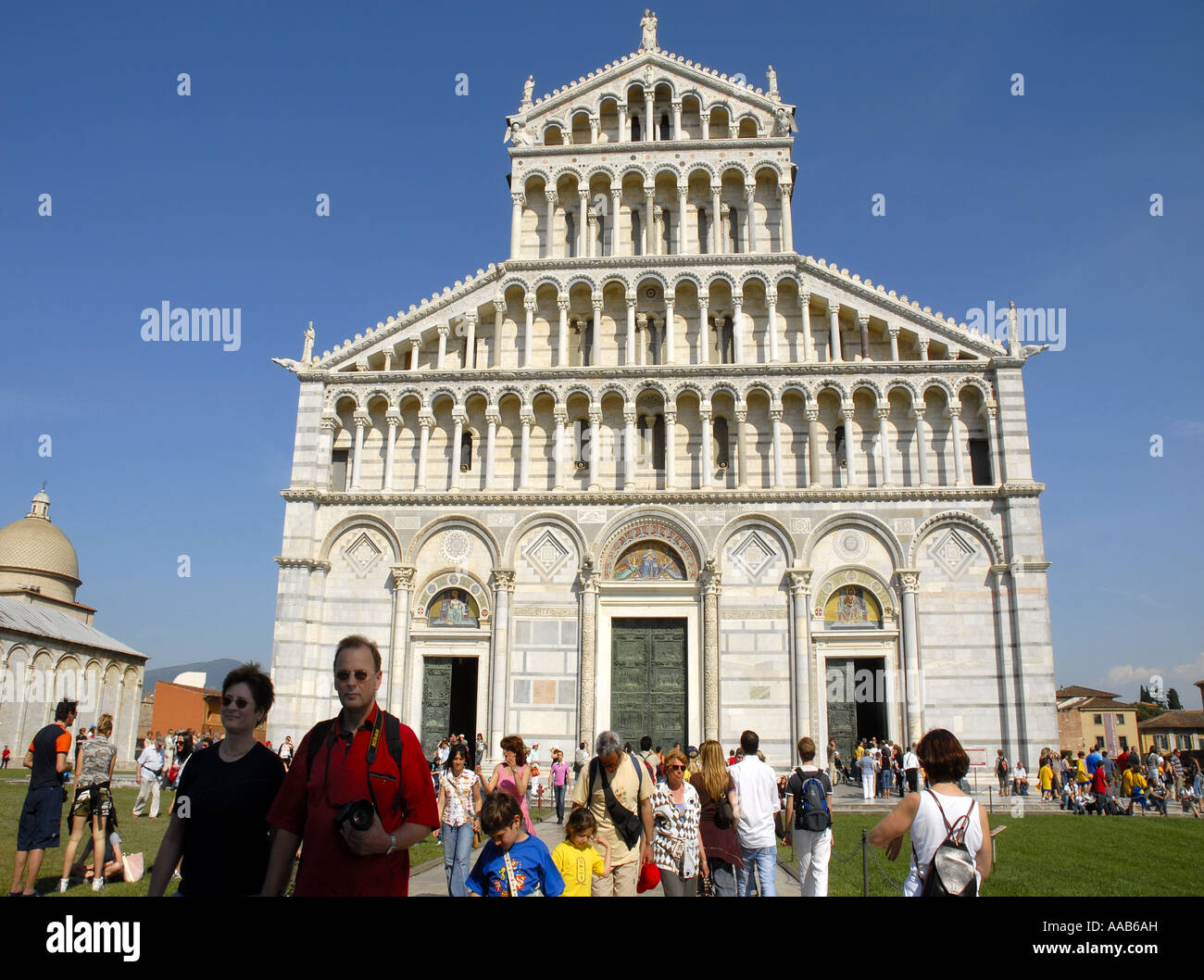 Tourists visiting the Duomo, in the heart of Campo dei Miracoli. Pisa. Italy.World   Heritage Site. April 2007 Stock Photo