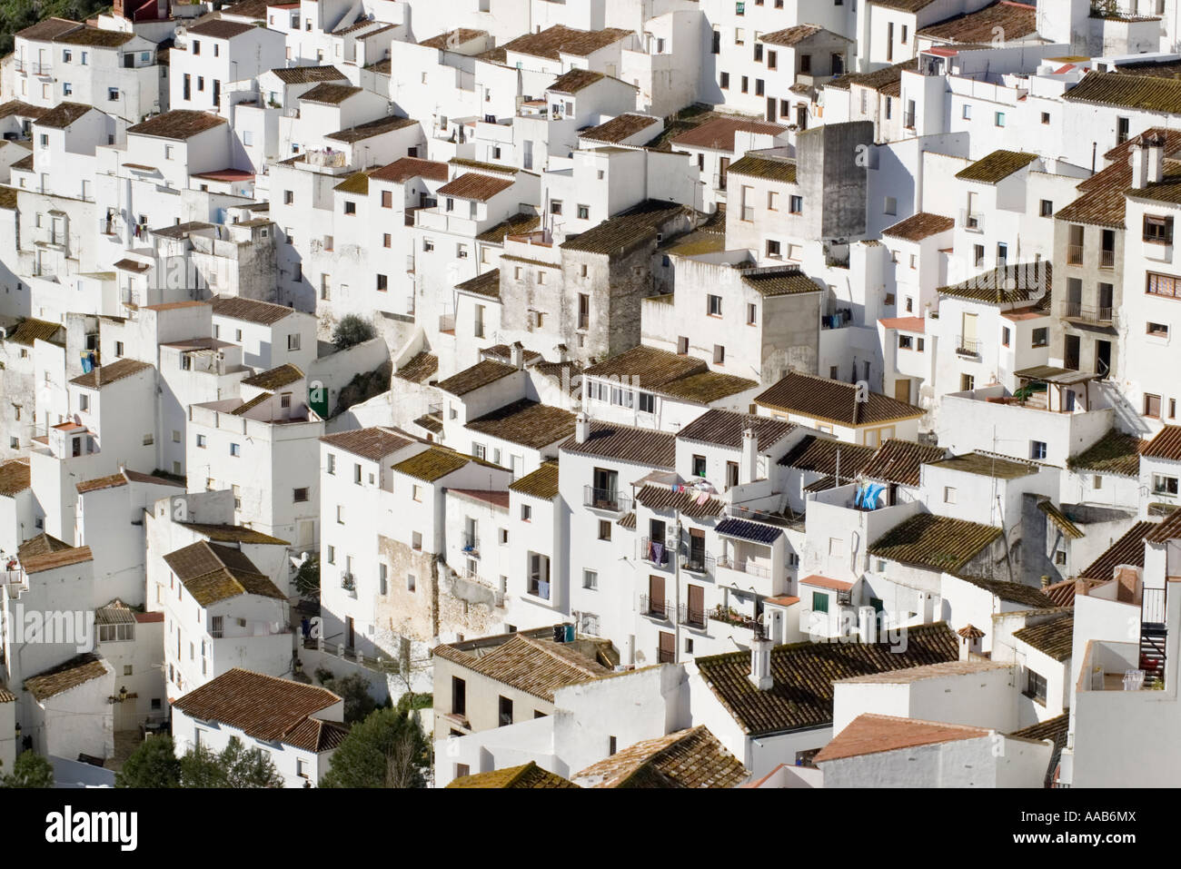 Close up of the white houses crowded one on the other at Casares Spain on a sunny winter afternoon Stock Photo