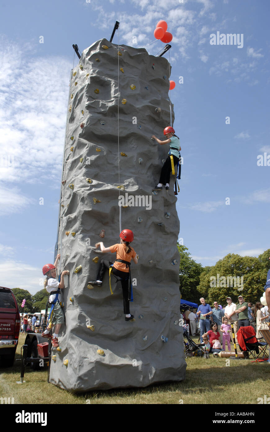 Children Rock Climbing at Wimbedon Village Fair. Stock Photo
