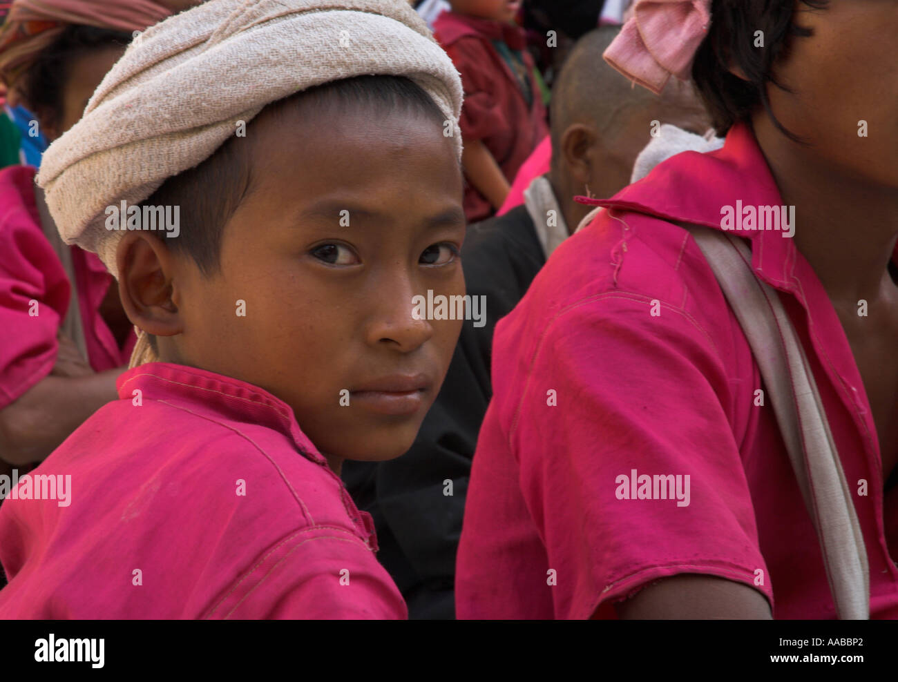 Myanmar Burma Yangon Shwedagon Paya portrait of youngster from ethnic minority wearing pink shirt Stock Photo