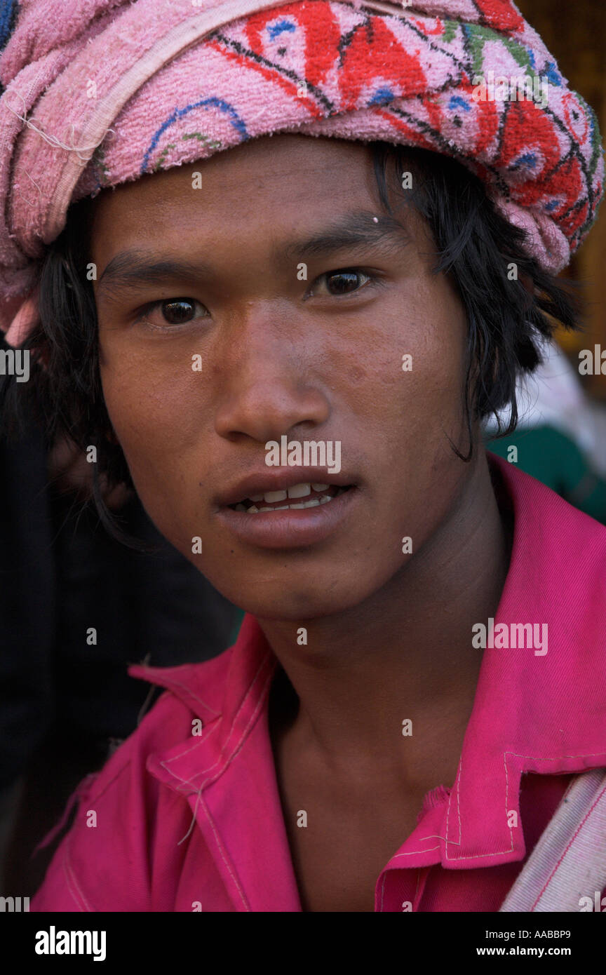 Myanmar Burma Yangon Shwedagon Paya portrait of young man from ethnic minority wearing turban and pink shirt Stock Photo