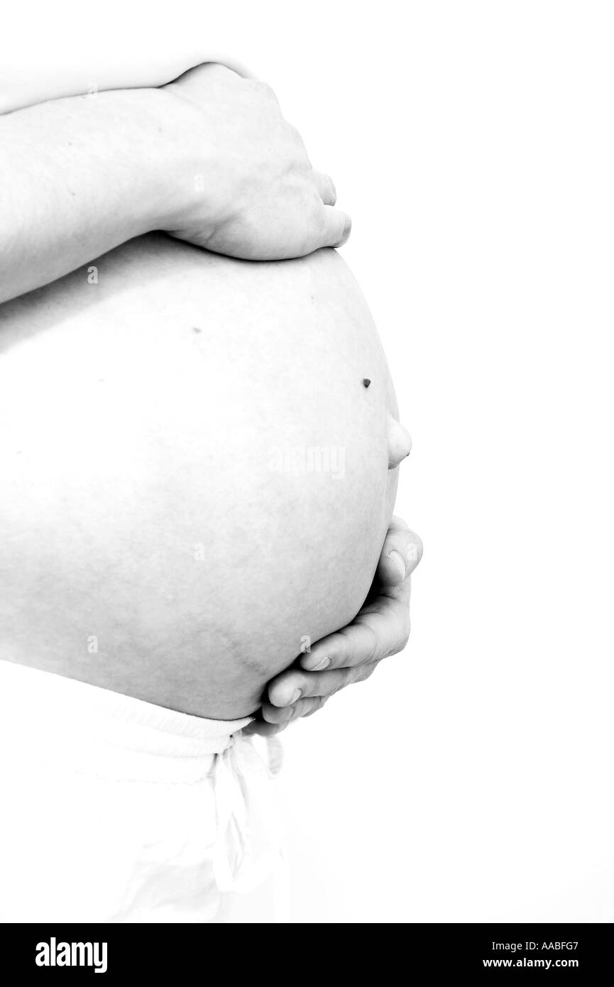 pregnant woman holding her belly Stock