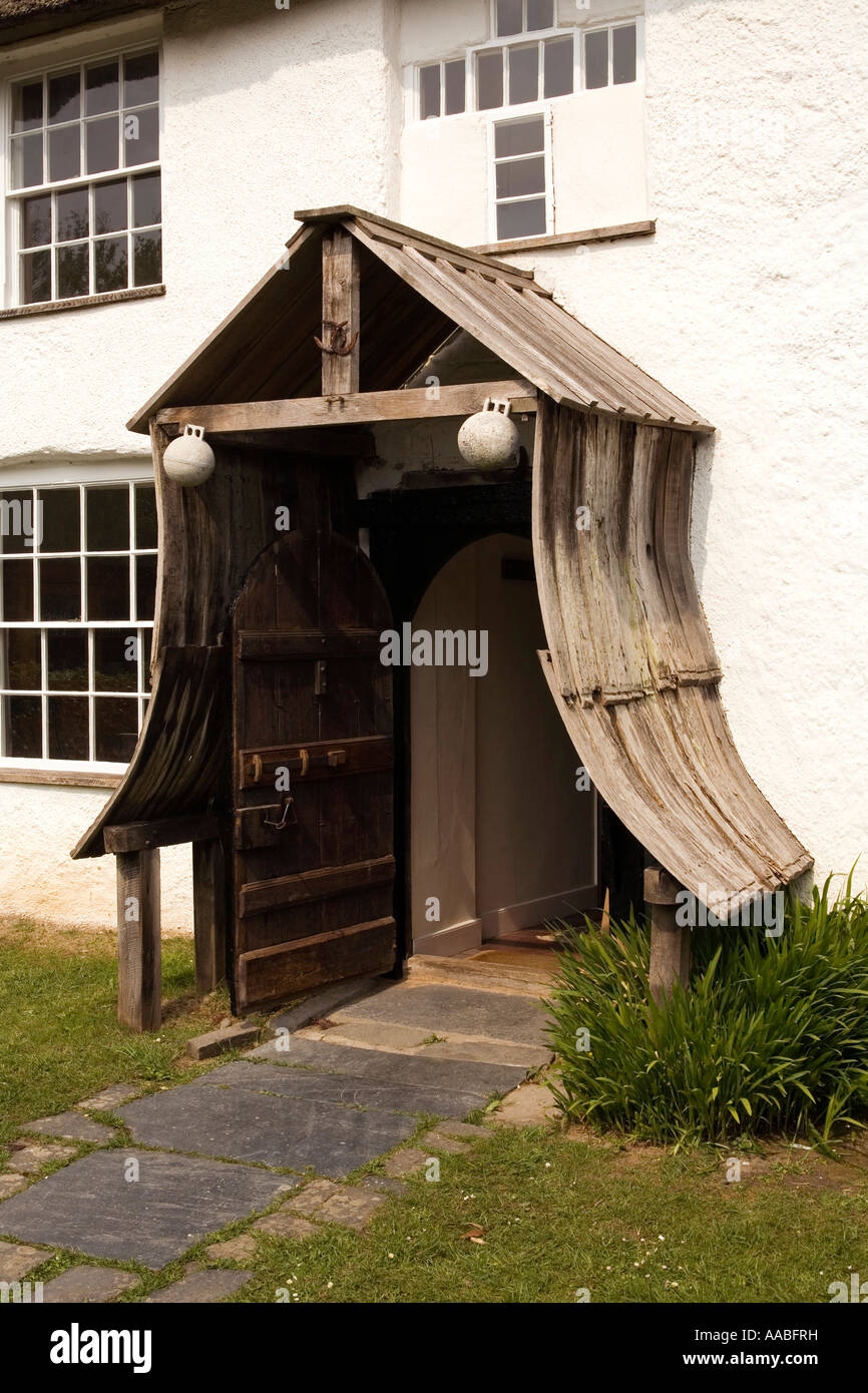 UK Cornwall Coombe village Hawkers Cottage showing wooden porch and cruciform window Stock Photo