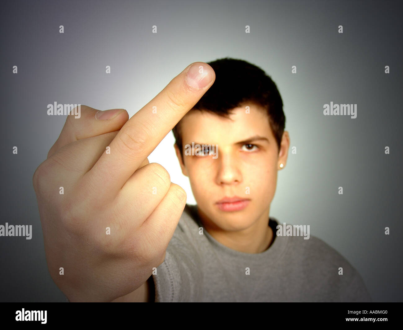 teenager shows the stinking finger Stock Photo