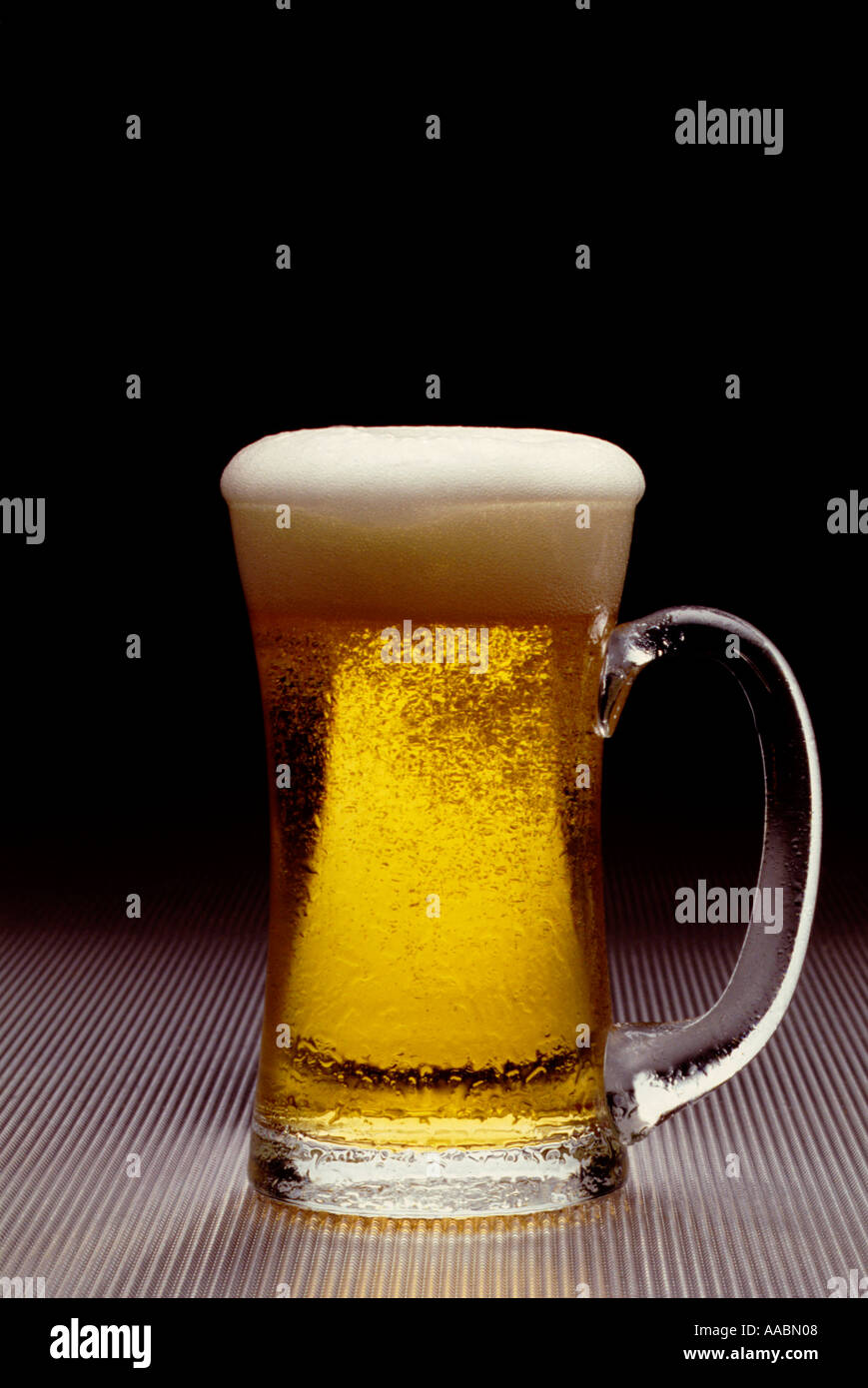 beer with foam head in beer mug Stock Photo Alamy