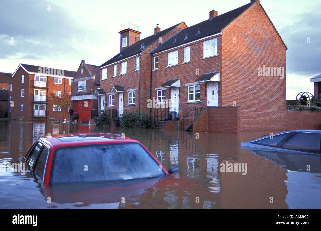 Flooded cars and houses in Upton Upon Severn Worcestershire after the river Severn bursts its banks Stock Photo