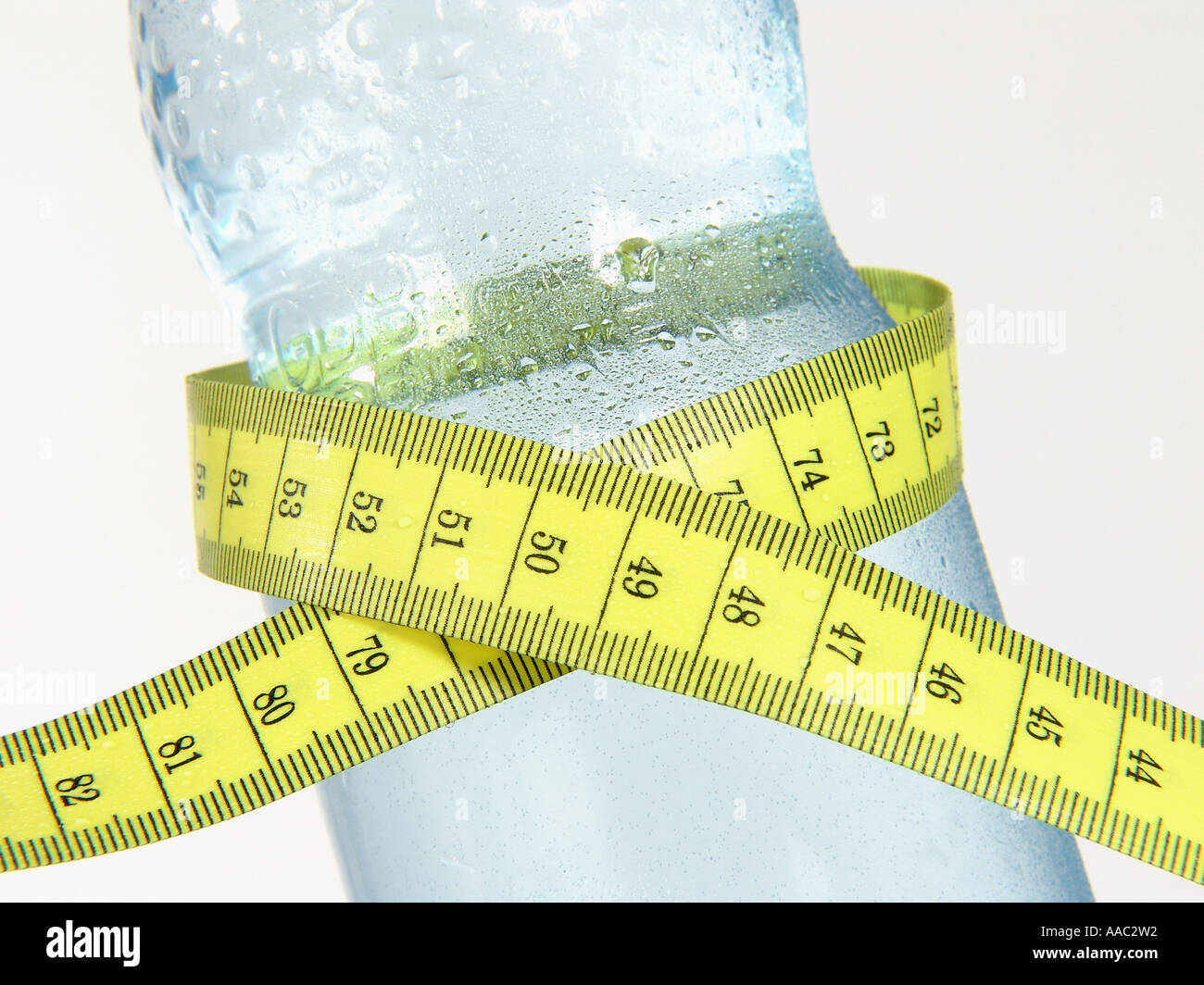 Mineral water bottle with tape measure Stock Photo