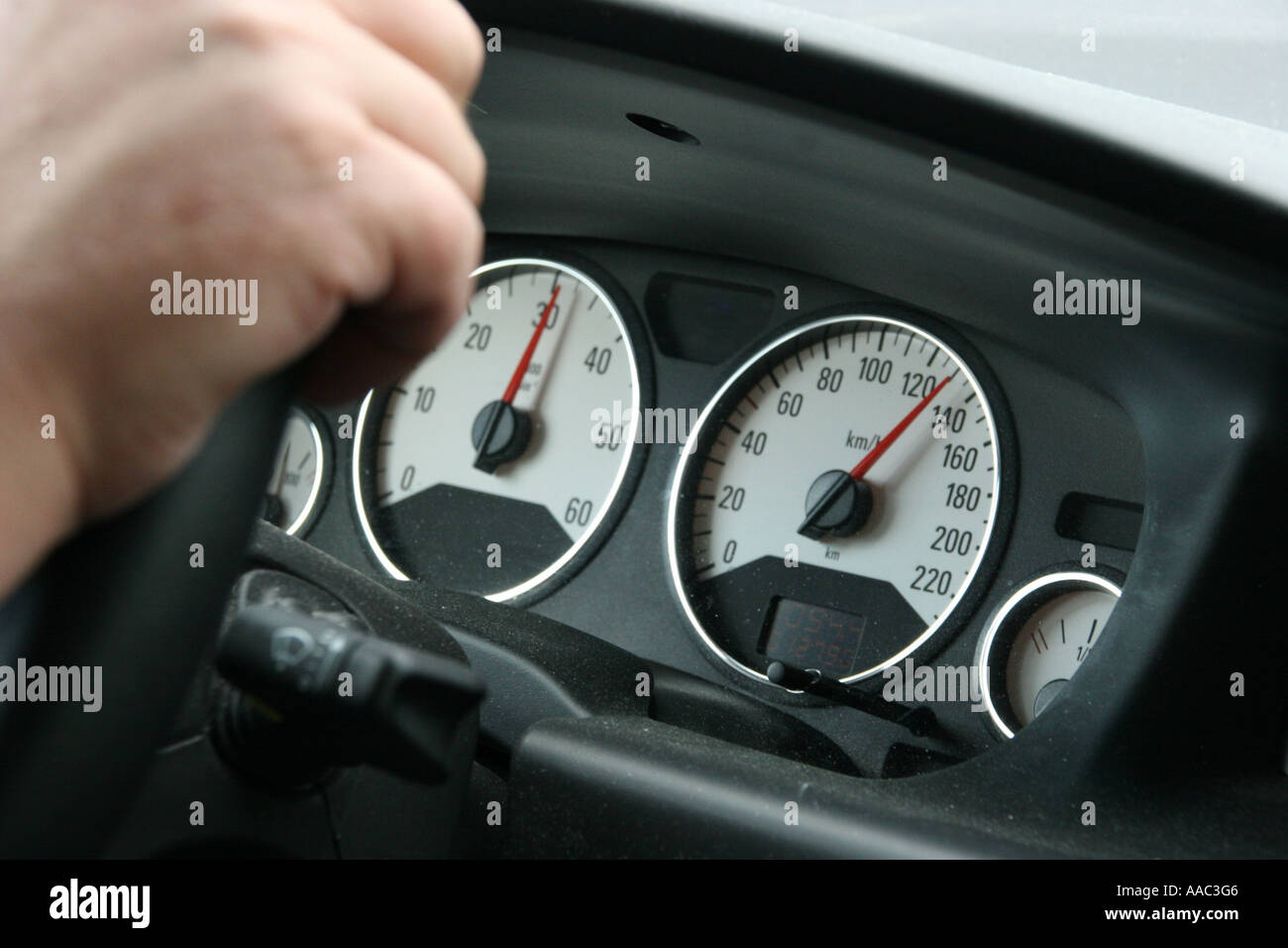 Speedometer in a car with speed 130 Stock Photo