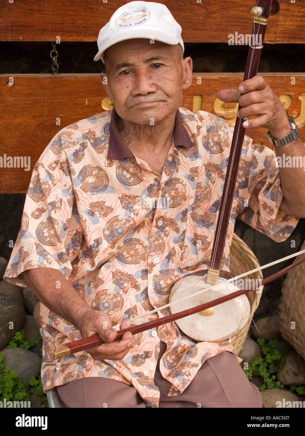 Lao musician with his traditional instrument Stock Photo - Alamy