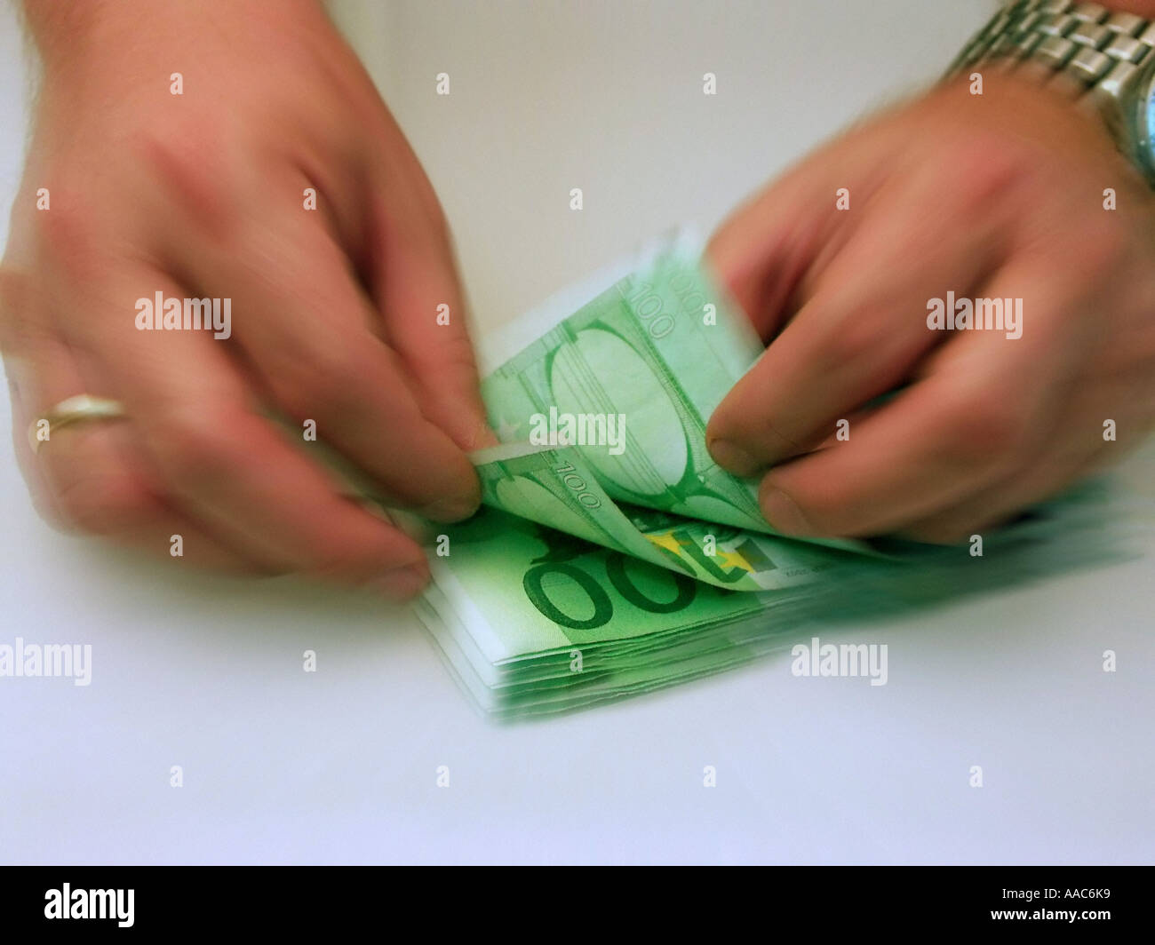 Hundred Euro banknotes are counted Stock Photo