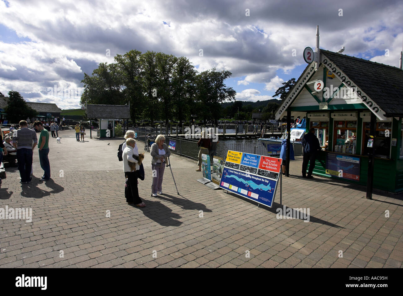 Crew updating Windermere Lake Cruises schedule timetable board on