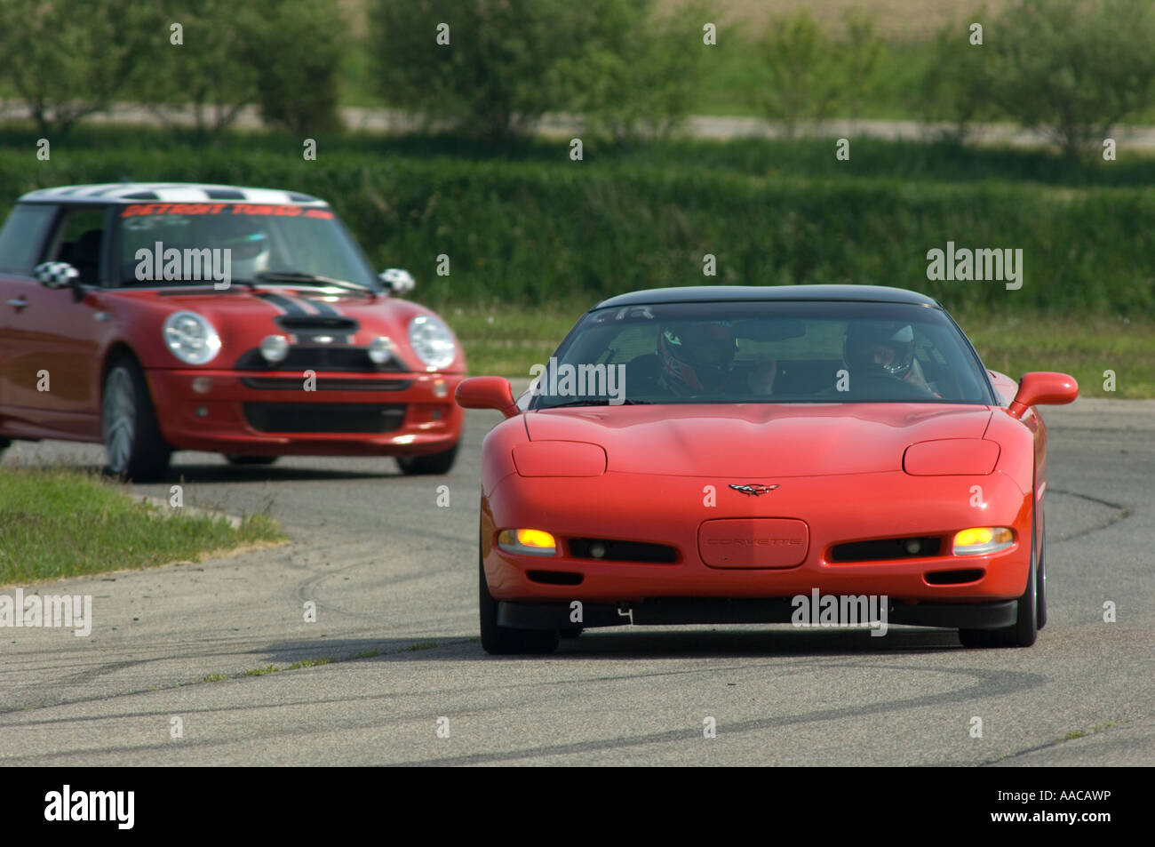 Chevrolet C5 Corvette followed by a MINI Cooper S at a track day Stock Photo