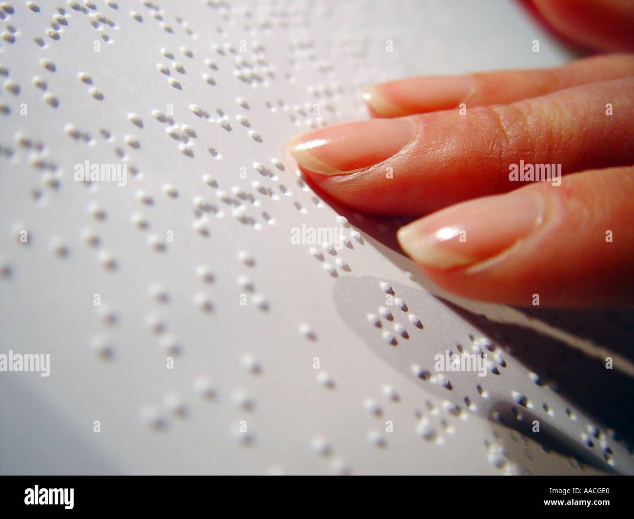 Braille reader with female hand Stock Photo Alamy