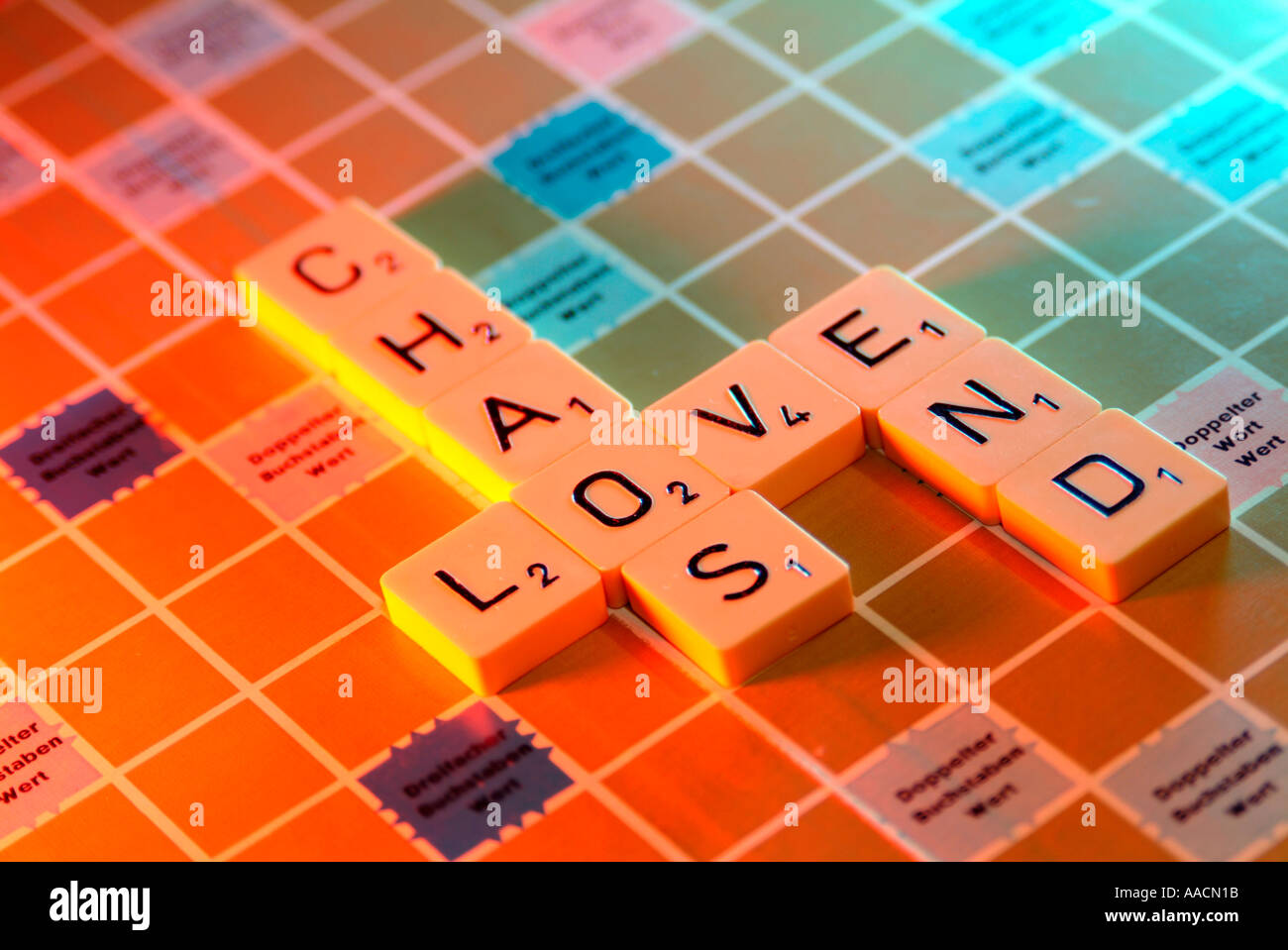 love chaos end crossword puzzle with scrabble Stock Photo Alamy
