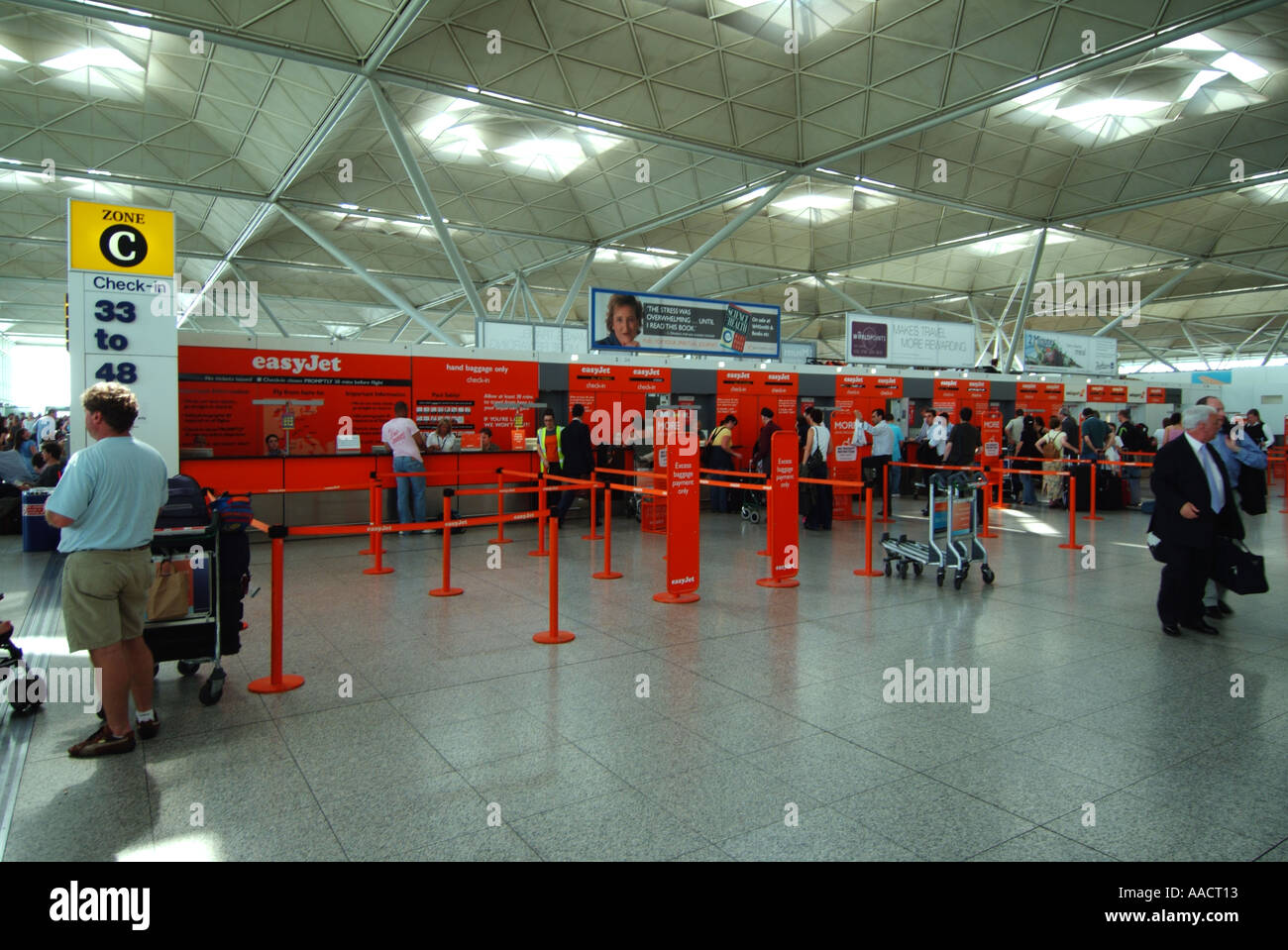 London Stansted Airport main terminal building interior and easyjet check in desks Stock Photo