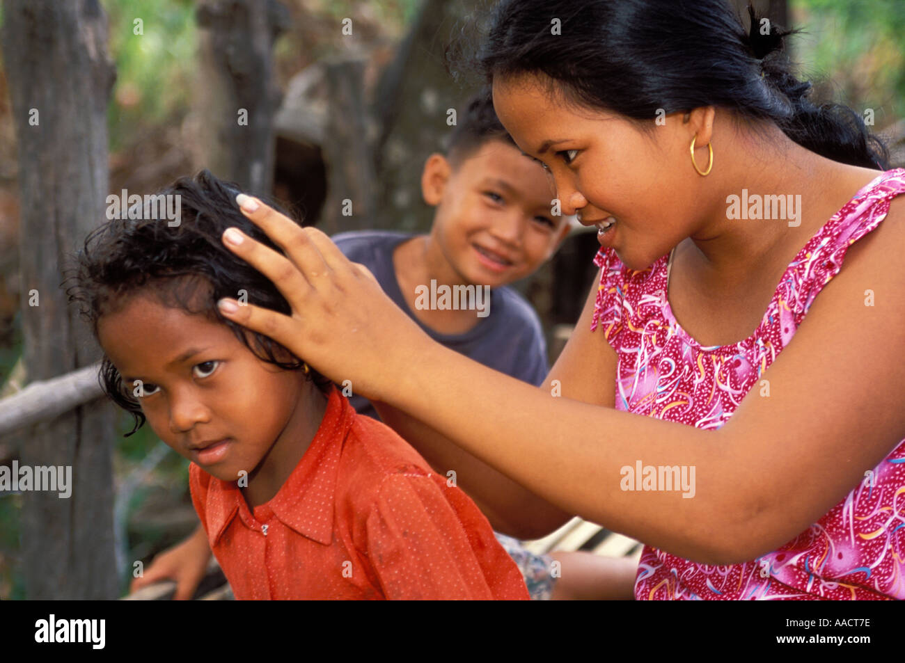 Cambodian Careful Mother Checks Her Child s Head For Lice Health And Hygiene In Country Village 